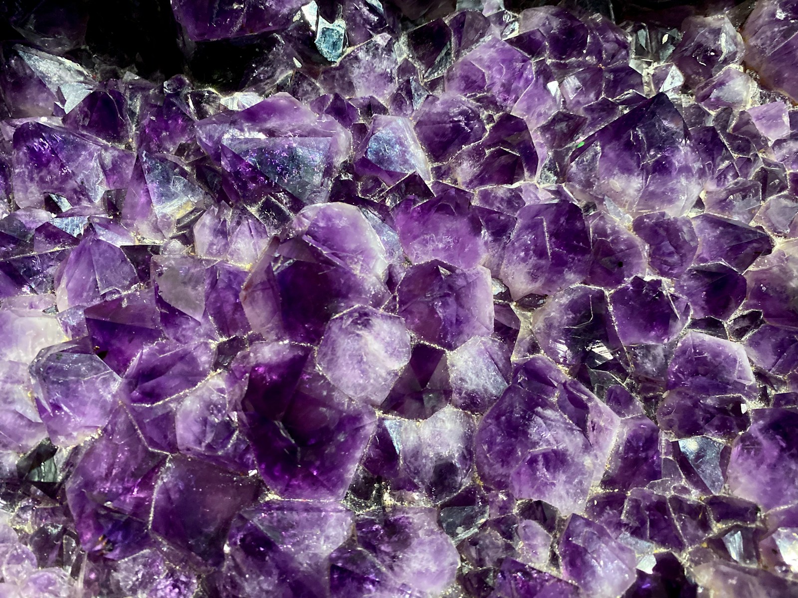 a close up of a bunch of purple rocks
